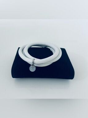White Triple Leather Endless Jewelry Bracelet with dangling charm.